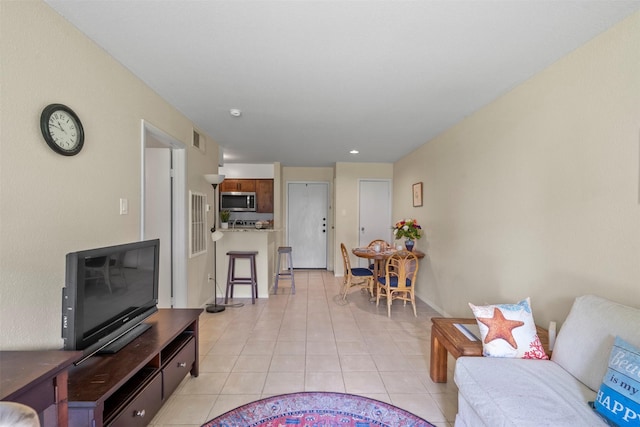13151 Walden Rd Unit 135, Montgomery, TX 77356 - living room featuring light tile patterned floors