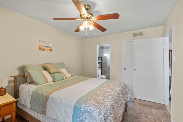 13151 Walden Rd Unit 135, Montgomery, TX 77356 - carpeted bedroom with a ceiling fan and ensuite bathroom