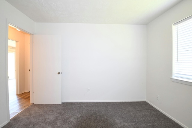 18811 Pine Trace Ct, Humble, TX 77346 - carpeted empty room with baseboards