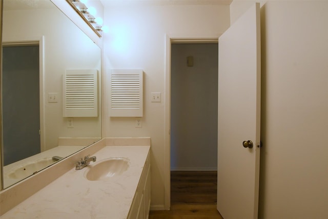 18811 Pine Trace Ct, Humble, TX 77346 - bathroom featuring wood finished floors and vanity