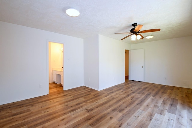 18811 Pine Trace Ct, Humble, TX 77346 - unfurnished room with light wood-type flooring, a ceiling fan, and baseboards