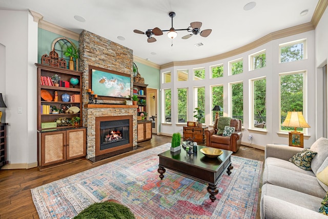1223 Eversham Way, Kingwood, TX 77339 - living room featuring crown molding, baseboards, a fireplace, and wood finished floors