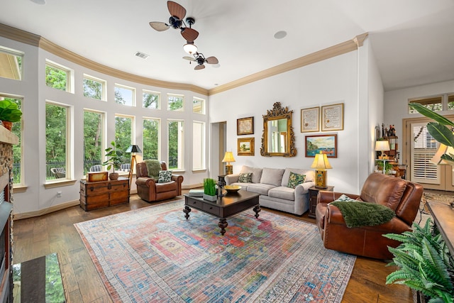 1223 Eversham Way, Kingwood, TX 77339 - living room featuring crown molding, hardwood / wood-style floors, a ceiling fan, and baseboards