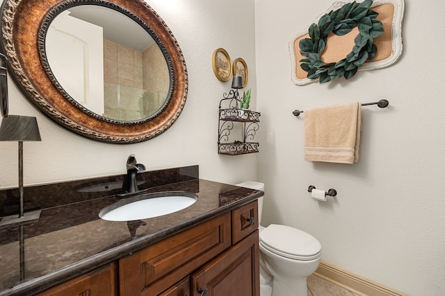 1223 Eversham Way, Kingwood, TX 77339 - full bathroom featuring vanity, toilet, and baseboards