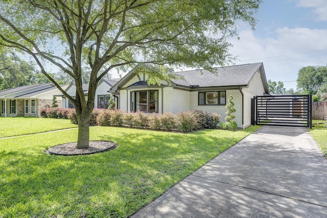 5623 Spellman Rd, Houston, TX 77096 - view of front of property featuring brick siding, concrete driveway, and a gate