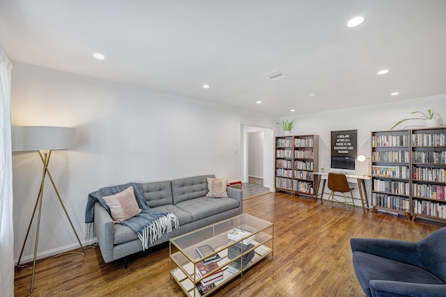 5623 Spellman Rd, Houston, TX 77096 - living room featuring wood finished floors, recessed lighting, and baseboards