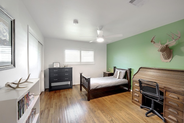 5623 Spellman Rd, Houston, TX 77096 - bedroom featuring light wood-type flooring and ceiling fan