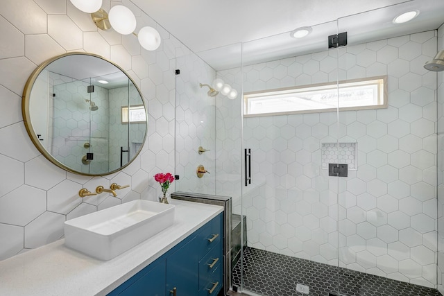 5623 Spellman Rd, Houston, TX 77096 - bathroom featuring a stall shower, tile walls, and vanity
