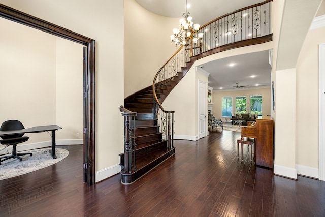 4302 Meyerwood Dr, Houston, TX 77096 - stairs featuring baseboards, wood finished floors, a ceiling fan, a chandelier, and ornamental molding