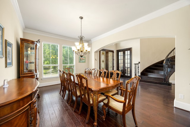 4302 Meyerwood Dr, Houston, TX 77096 - dining space featuring arched walkways, a chandelier, stairway, baseboards, and ornamental molding