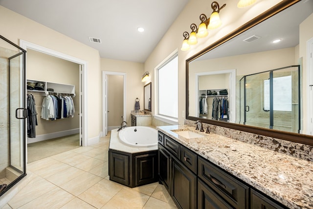 4302 Meyerwood Dr, Houston, TX 77096 - full bath featuring a shower stall, tile patterned flooring, a garden tub, vanity, and a walk in closet