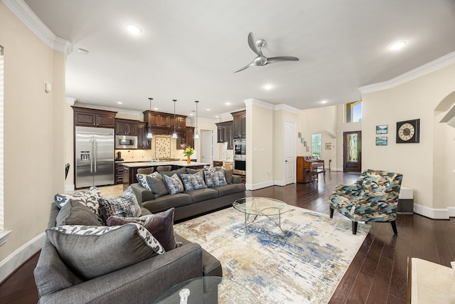 4302 Meyerwood Dr, Houston, TX 77096 - living room with a ceiling fan, arched walkways, ornamental molding, baseboards, and dark wood-type flooring
