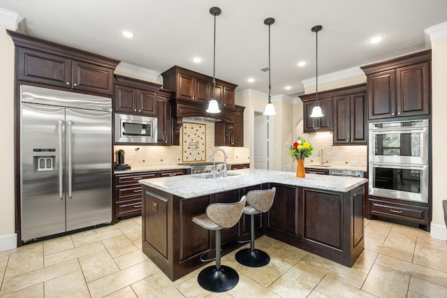 4302 Meyerwood Dr, Houston, TX 77096 - kitchen featuring built in appliances, a sink, an island with sink, dark brown cabinetry, and decorative backsplash
