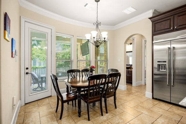 4302 Meyerwood Dr, Houston, TX 77096 - dining space with crown molding, arched walkways, a chandelier, and baseboards