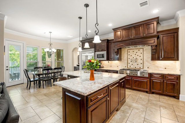 4302 Meyerwood Dr, Houston, TX 77096 - kitchen with stainless steel appliances, a chandelier, tasteful backsplash, pendant lighting, and a kitchen island