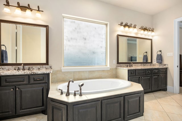 4302 Meyerwood Dr, Houston, TX 77096 - full bathroom with tile patterned floors, a garden tub, and two vanities
