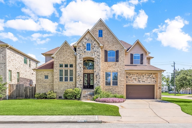 4302 Meyerwood Dr, Houston, TX 77096 - french country inspired facade featuring an attached garage, concrete driveway, roof with shingles, and brick siding