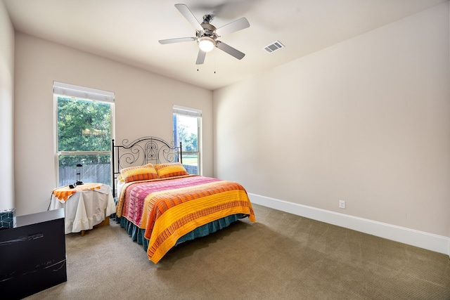 4302 Meyerwood Dr, Houston, TX 77096 - carpeted bedroom with baseboards and a ceiling fan