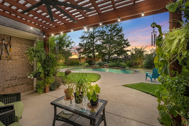 7903 Black Horse Cv, Missouri City, TX 77459 - pool at dusk with a pergola, a fenced backyard, and a patio