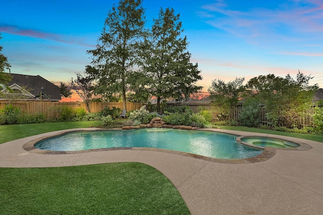 7903 Black Horse Cv, Missouri City, TX 77459 - pool at dusk with a patio area and a pool with connected hot tub