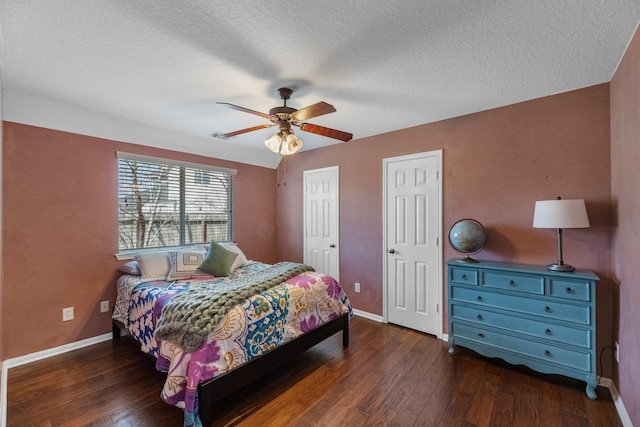 7903 Black Horse Cv, Missouri City, TX 77459 - bedroom featuring hardwood / wood-style flooring, baseboards, a textured ceiling, and a ceiling fan