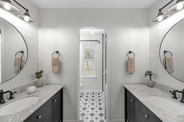 7903 Black Horse Cv, Missouri City, TX 77459 - bathroom featuring two vanities, baseboards, and tile patterned floors