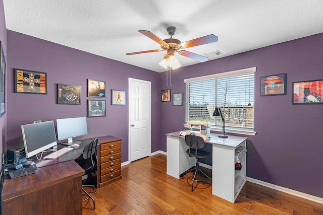 7903 Black Horse Cv, Missouri City, TX 77459 - office with a ceiling fan, baseboards, wood-type flooring, and a textured ceiling