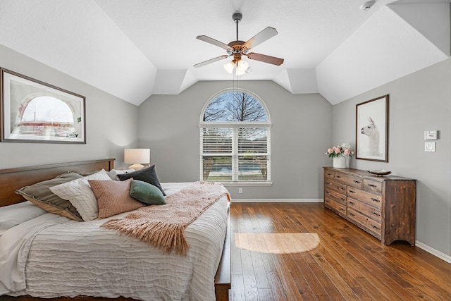 7903 Black Horse Cv, Missouri City, TX 77459 - bedroom with hardwood / wood-style floors, baseboards, vaulted ceiling, and ceiling fan