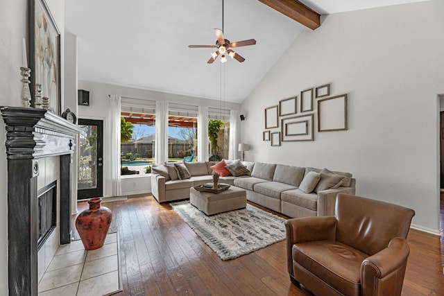 7903 Black Horse Cv, Missouri City, TX 77459 - living room featuring ceiling fan, a fireplace, and light wood-style floors