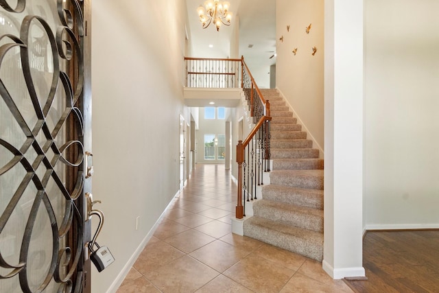 10410 Kingston Creek Ln, Cypress, TX 77433 - foyer entrance featuring stairway, a chandelier, a towering ceiling, baseboards, and ceiling fan