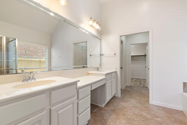 10410 Kingston Creek Ln, Cypress, TX 77433 - full bath featuring double vanity, a shower stall, baseboards, a spacious closet, and a tub to relax in