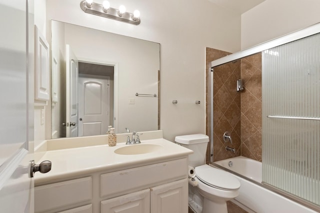10410 Kingston Creek Ln, Cypress, TX 77433 - bathroom featuring toilet, vanity, and bath / shower combo with glass door