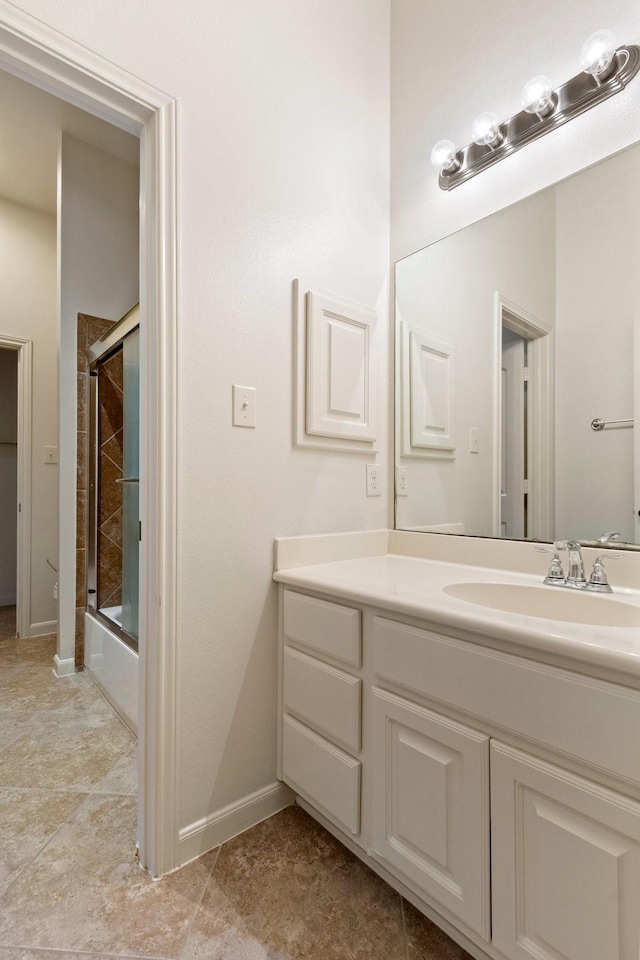10410 Kingston Creek Ln, Cypress, TX 77433 - bathroom with vanity, enclosed tub / shower combo, and baseboards