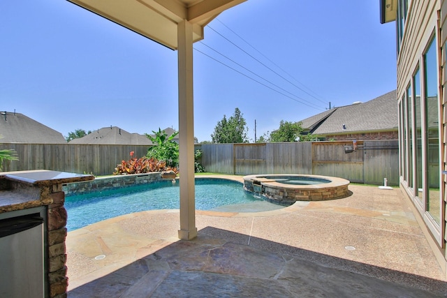10410 Kingston Creek Ln, Cypress, TX 77433 - view of swimming pool featuring a fenced backyard, a patio area, and a pool with connected hot tub
