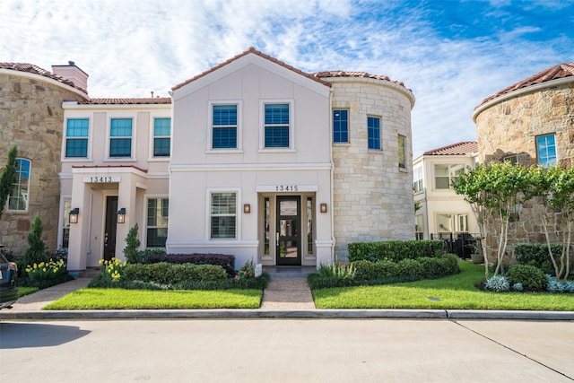 13415 Preston Cliff Ct, Houston, TX 77077 - view of front of house featuring stucco siding, stone siding, and a tiled roof