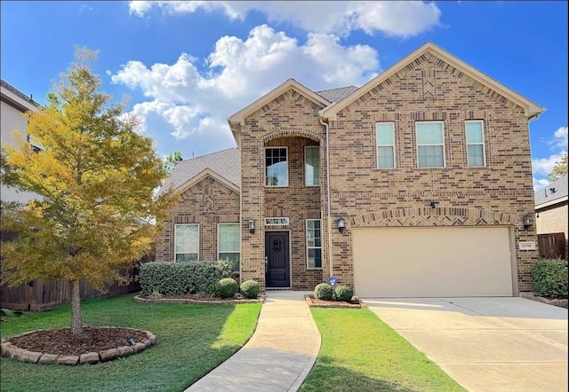 12714 Sweet Root Ln, Humble, TX 77346 - traditional home featuring brick siding, concrete driveway, a front lawn, and a garage