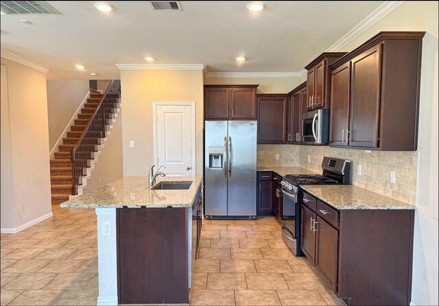 12714 Sweet Root Ln, Humble, TX 77346 - kitchen featuring stainless steel appliances, a sink, tasteful backsplash, light stone counters, and a kitchen island with sink