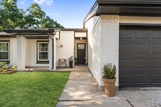 4806 Marburg Ct, Houston, TX 77066 - property entrance with a yard, a garage, and brick siding