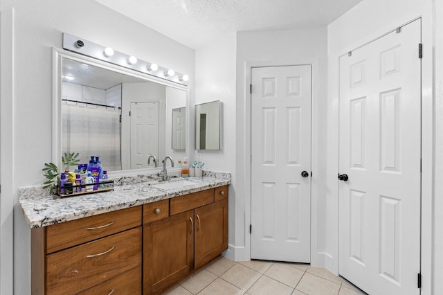 4806 Marburg Ct, Houston, TX 77066 - bathroom with tile patterned flooring, vanity, curtained shower, and a textured ceiling