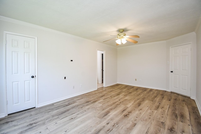 3119 Wagon Trail Dr, Sugar Land, TX 77479 - unfurnished bedroom featuring ornamental molding, baseboards, light wood-style flooring, and ceiling fan