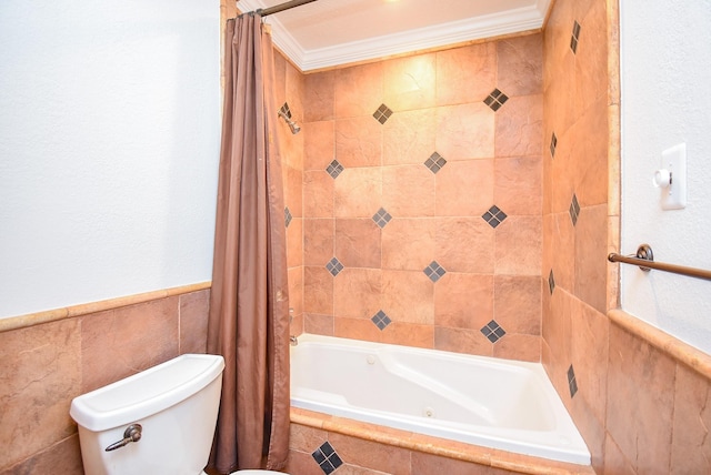 3119 Wagon Trail Dr, Sugar Land, TX 77479 - bathroom featuring tiled shower / bath combo, toilet, tile walls, ornamental molding, and a wainscoted wall