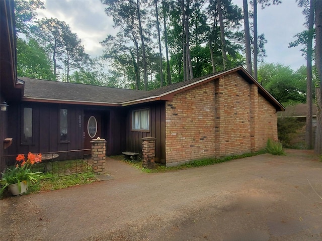 200 El Pinto Dr, Lumberton, TX 77657 - view of front of property with board and batten siding and brick siding