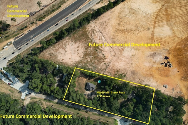 40029 Mill Creek Rd, Magnolia, TX 77354 - aerial view of property and surrounding area featuring property boundaries highlighted and a highway