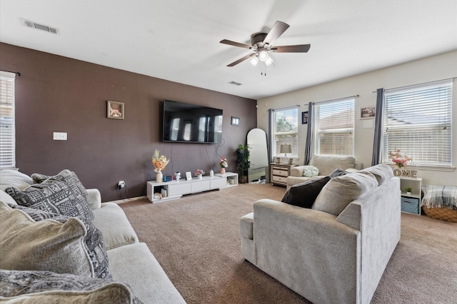 2415 Fallen Pine Ln, Houston, TX 77088 - living room featuring carpet flooring and ceiling fan