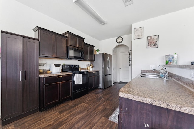 2415 Fallen Pine Ln, Houston, TX 77088 - kitchen featuring black appliances, a sink, arched walkways, dark wood-style floors, and dark brown cabinetry
