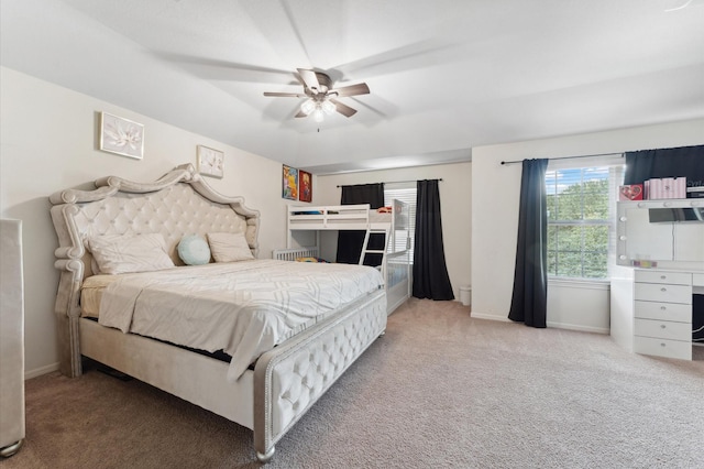 2415 Fallen Pine Ln, Houston, TX 77088 - carpeted bedroom with baseboards and a ceiling fan