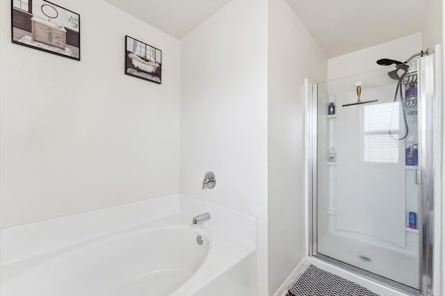 2415 Fallen Pine Ln, Houston, TX 77088 - full bathroom featuring a stall shower, a bath, and baseboards