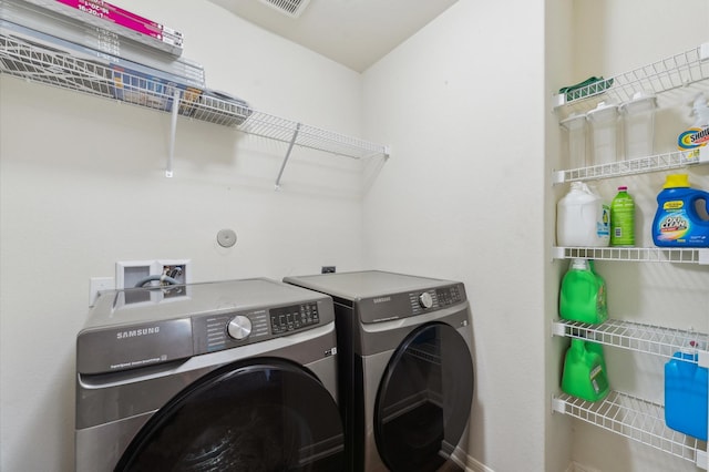 2415 Fallen Pine Ln, Houston, TX 77088 - clothes washing area with washer and clothes dryer