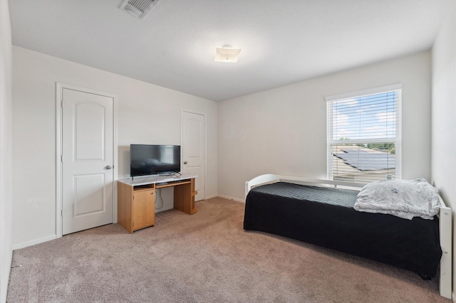 2415 Fallen Pine Ln, Houston, TX 77088 - bedroom featuring light colored carpet and baseboards