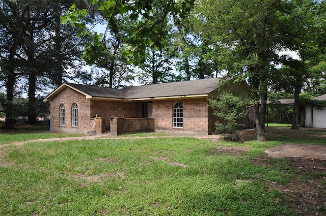 40103 Mill Creek Rd, Magnolia, TX 77354 - view of front of house featuring brick siding and a front lawn